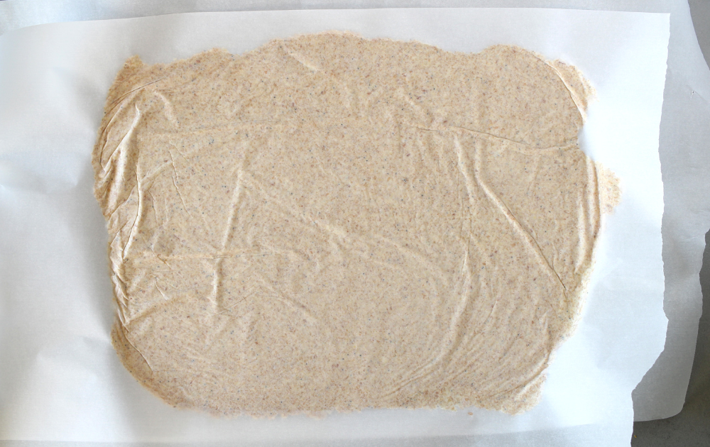 Instructions - roll the keto cracker dough between 2 sheets of parchment paper