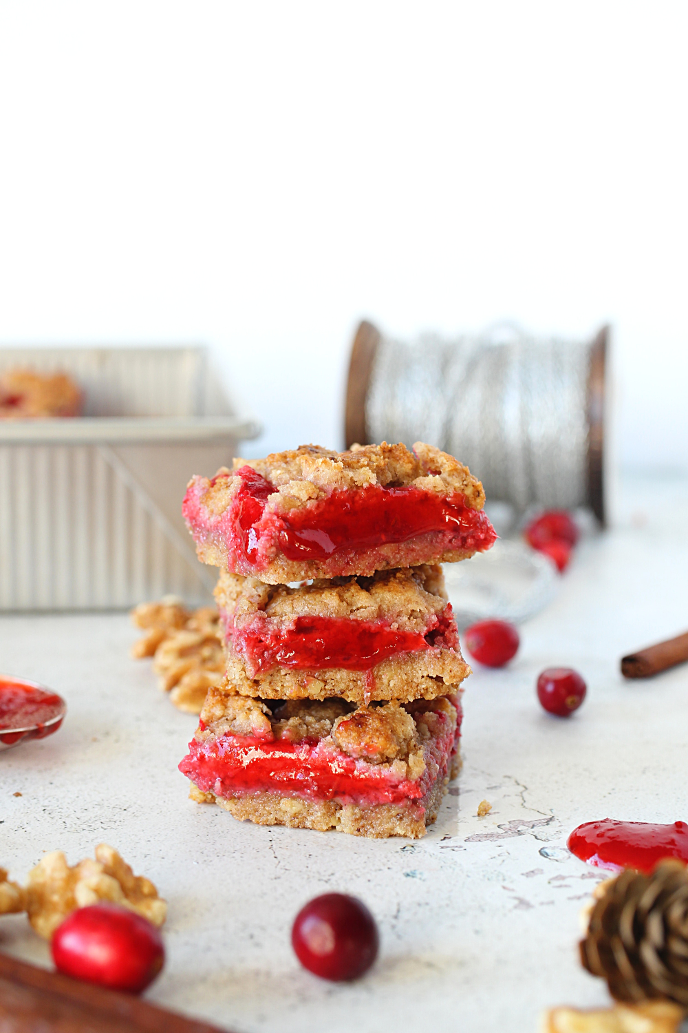 easy keto leftover cranberry sauce crumb bars stacked on top of each other