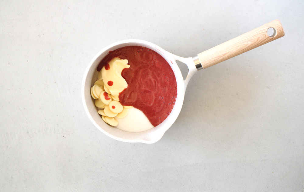 Pour the beet mixture into a saucepan, and add the butter, sugar-free white chocolate, and sweetener. Heat on medium-low heat, stirring constantly until all the ingredients have melted and are blended together.  Remove from heat.