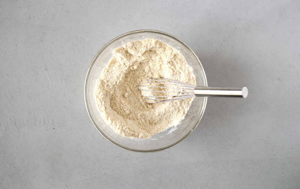 In a separate small bowl, combine the flours, whey, salt, baking soda and xanthan gum. Using a whisk, combine the ingredients and set aside.