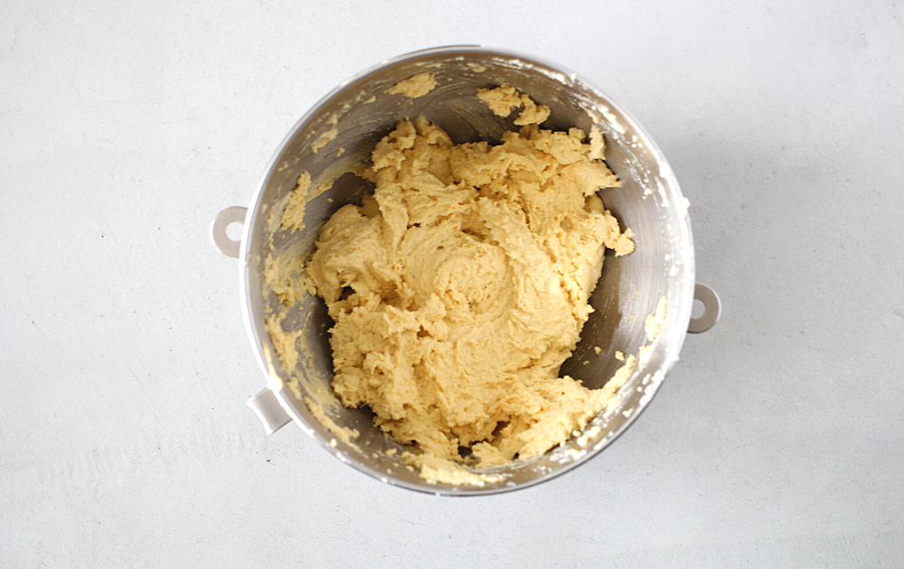 Alternate adding ⅓rd of the dry ingredients into the butter and egg mixture, beating for 30 seconds before adding ½ of the milk. Repeat the process, ending with the dry ingredients, until all the milk and flours have been mixed together. Add in the vanilla and beat for an additional 1 minute.