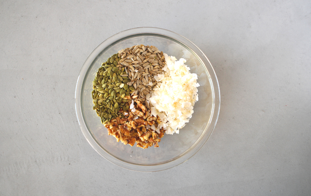 Instructions - Mix the seeds, nuts and coconut together in a large bowl