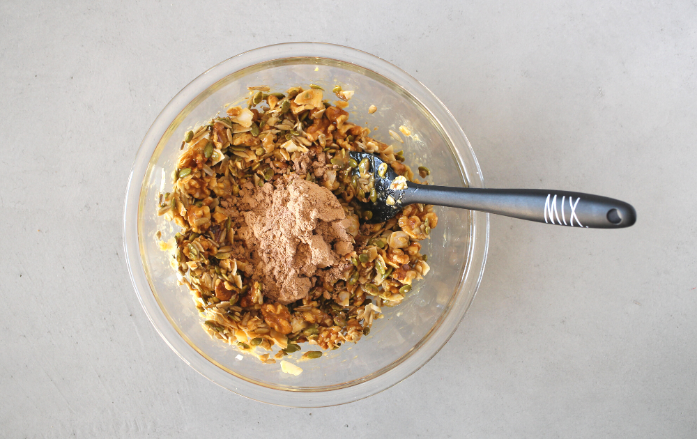 Mix the peanut butter into the seeds and nuts and then mix in the protein powder