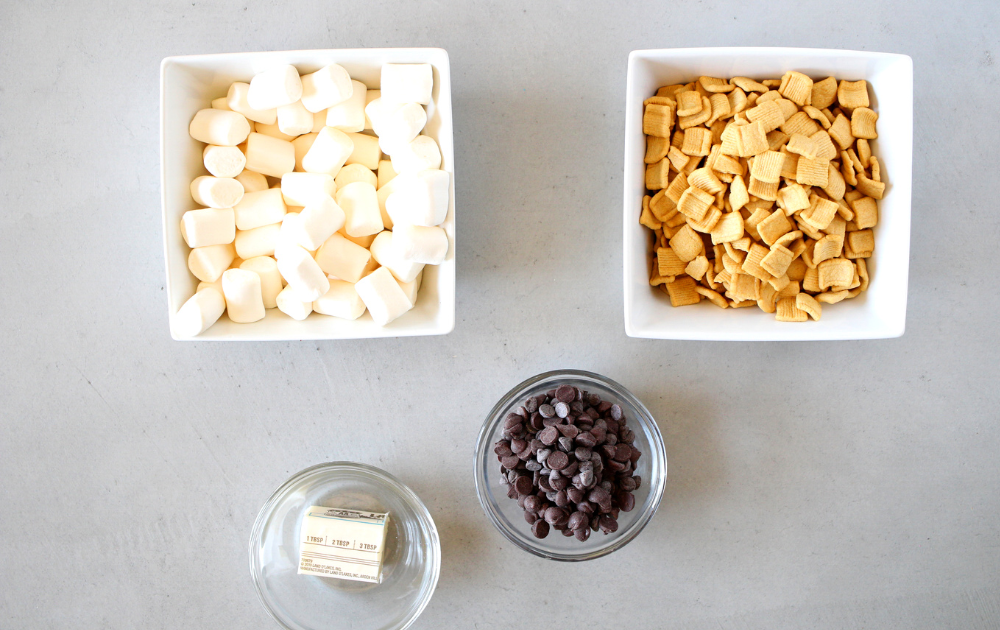 ingredients for the keto cereal s'mores bars include sugar-free marshmallows, keto cereal, butter and sugar-free chocolate chips