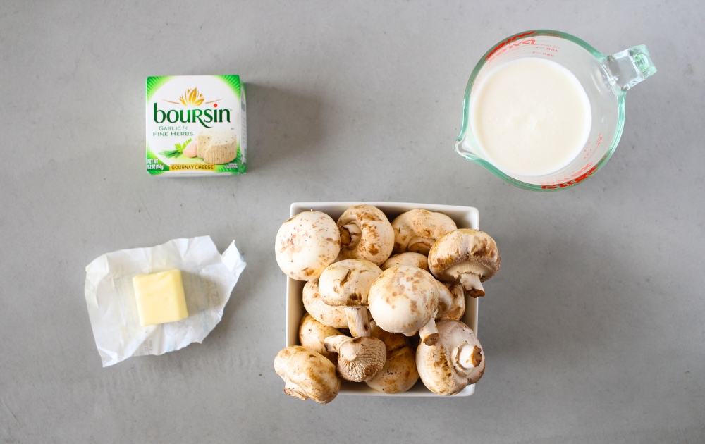 ingredients for making these keto Boursin mushrooms include, Boursin cheese, mushrroms, heavy cream and butter