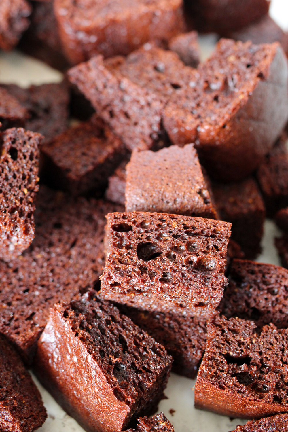 homemade chocolate keto cake cut into chunks