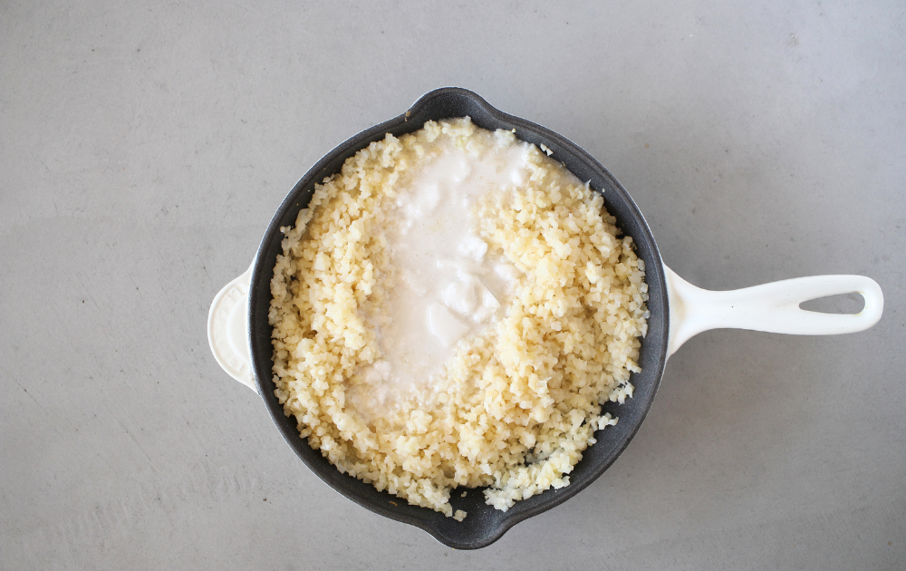 add the coconut milk until the milk is absorbed by the cauliflower reice