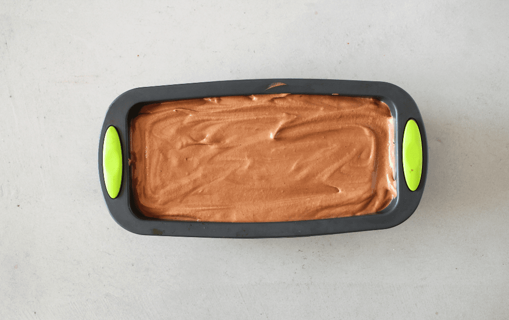 top view of a silicone loaf pan filled with keto chocolate semifreddo before freezing.