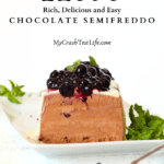 front view of a sliced sugar-free chocolate semifreddo with mint and sugar-free blueberry pie filling