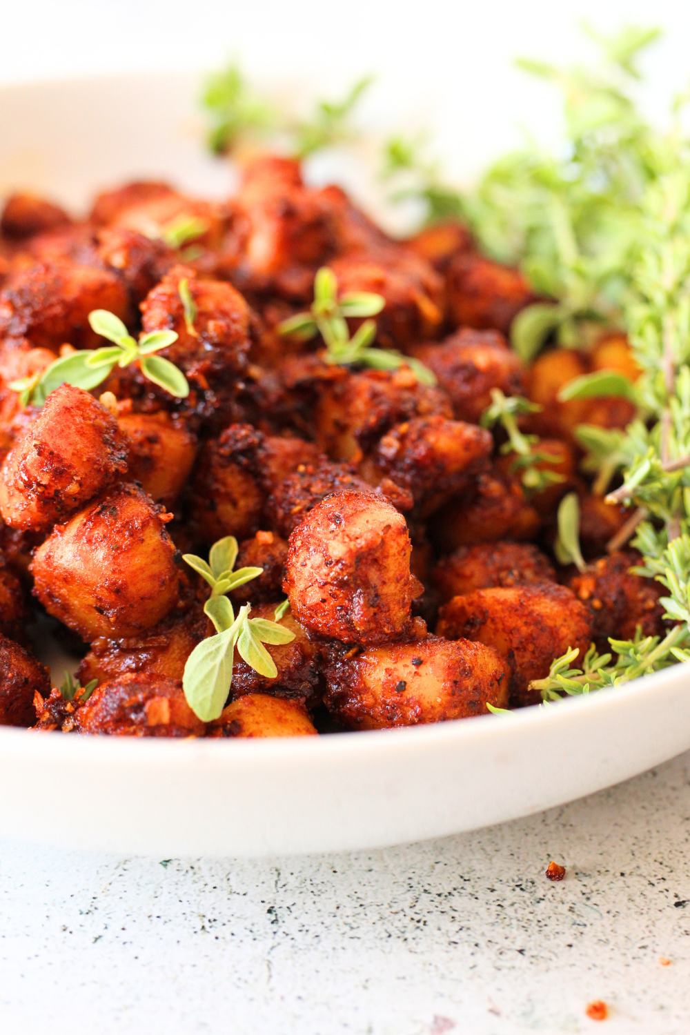 front view of a bowl of keto scallops with herbs