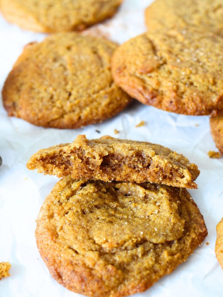 view of the chewy inside of these keto and gluten-free pumpkin cookies. More sugar-free cookies are scattered throughtout