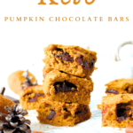 3 stacked keto pumpkin chocolate bars for fall with pumpkins in the background