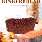 the front view of a perfectly textured, nice and moist keto pumpkin gingerbread with scattered gingerbread cookies