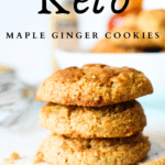 3 keto maple ginger cookies stacke on top of each other with a whisk and a bowl of more sugar-free ginger cookies in the background