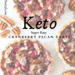 top view of sugar-free cranberry pecan pies with pecans scattered around