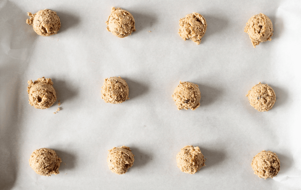 cold sugar-free pecan cookies rolled into balls before being baked.