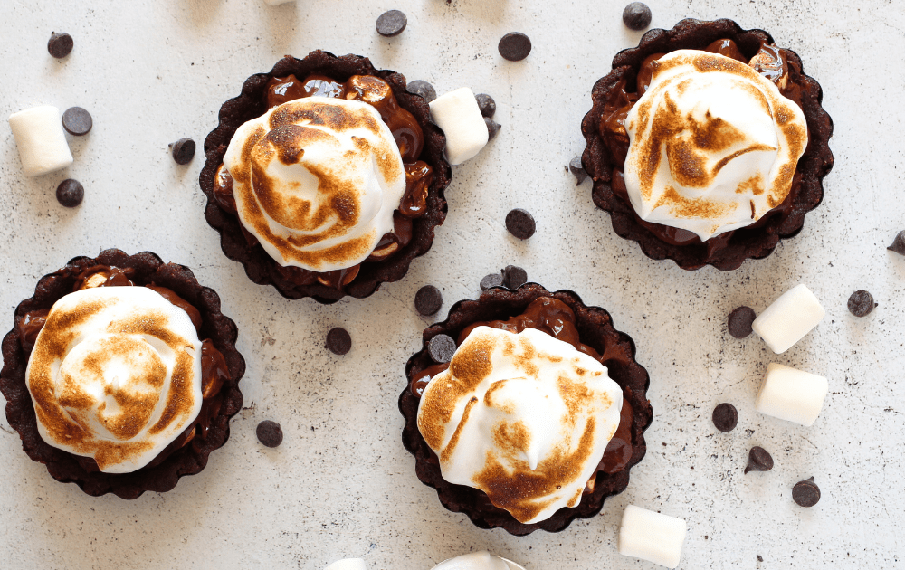 top view of 4 individual sugar-free marshmallow fluff frosting on top of a keto chocolate pie