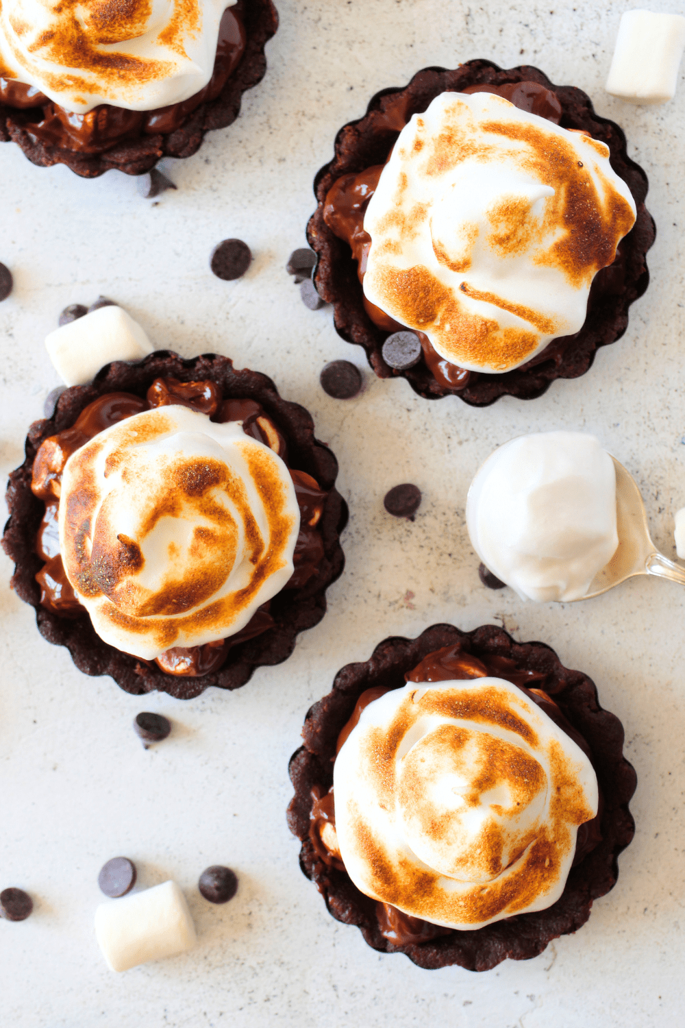 top view of 4 mini no-bake keto pies with chocolate filling and sugar-free marshmallows