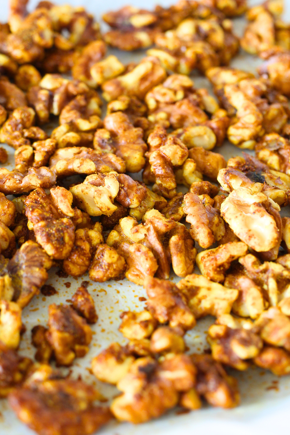 top view of an easy keto appetizer made from oven roasted walnuts tossed in curry spices