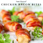keto bacon-wrapped mustard bites on a platter with fresh cut herbs as decoration