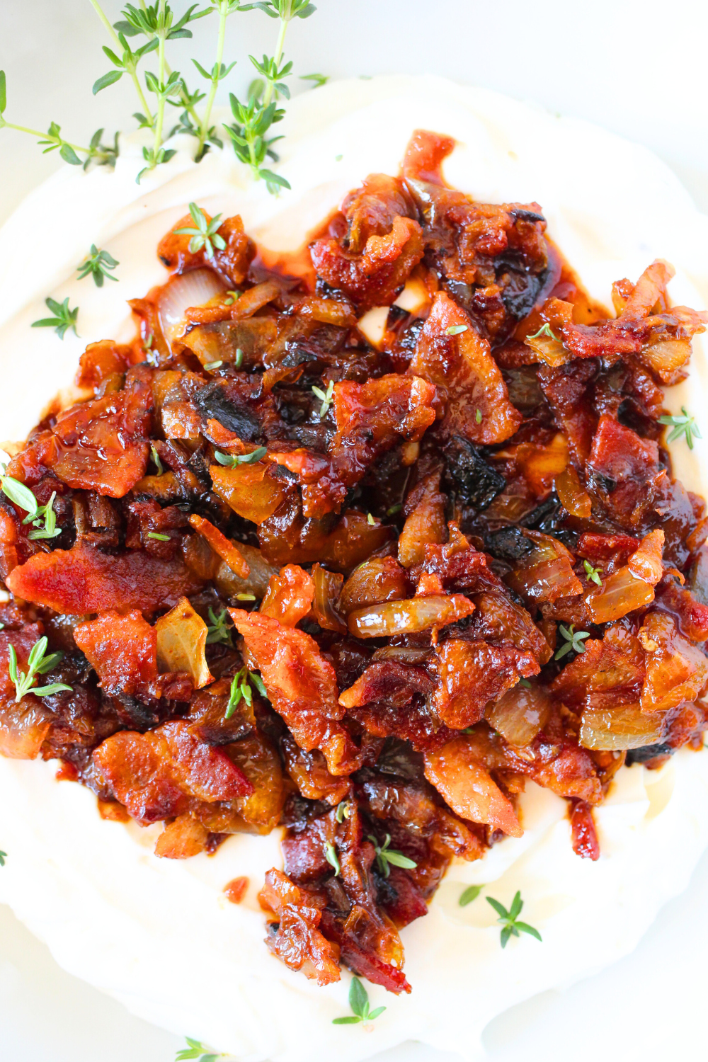 a bowl filled with whipped goat cheese and keto smoky bacon jam