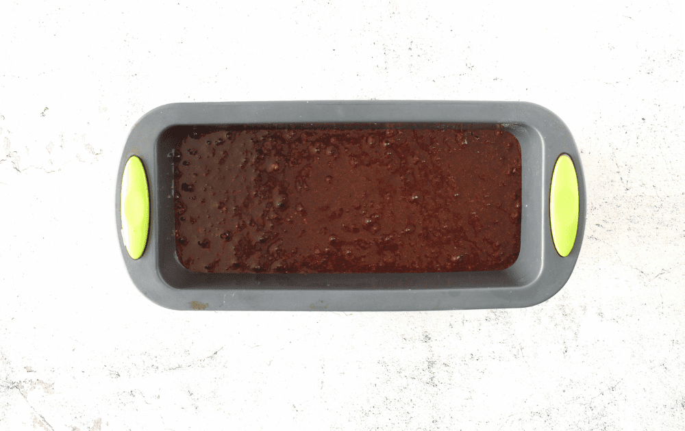top view of a silicon loaf pan containing the batter for these healthy high protein brownies