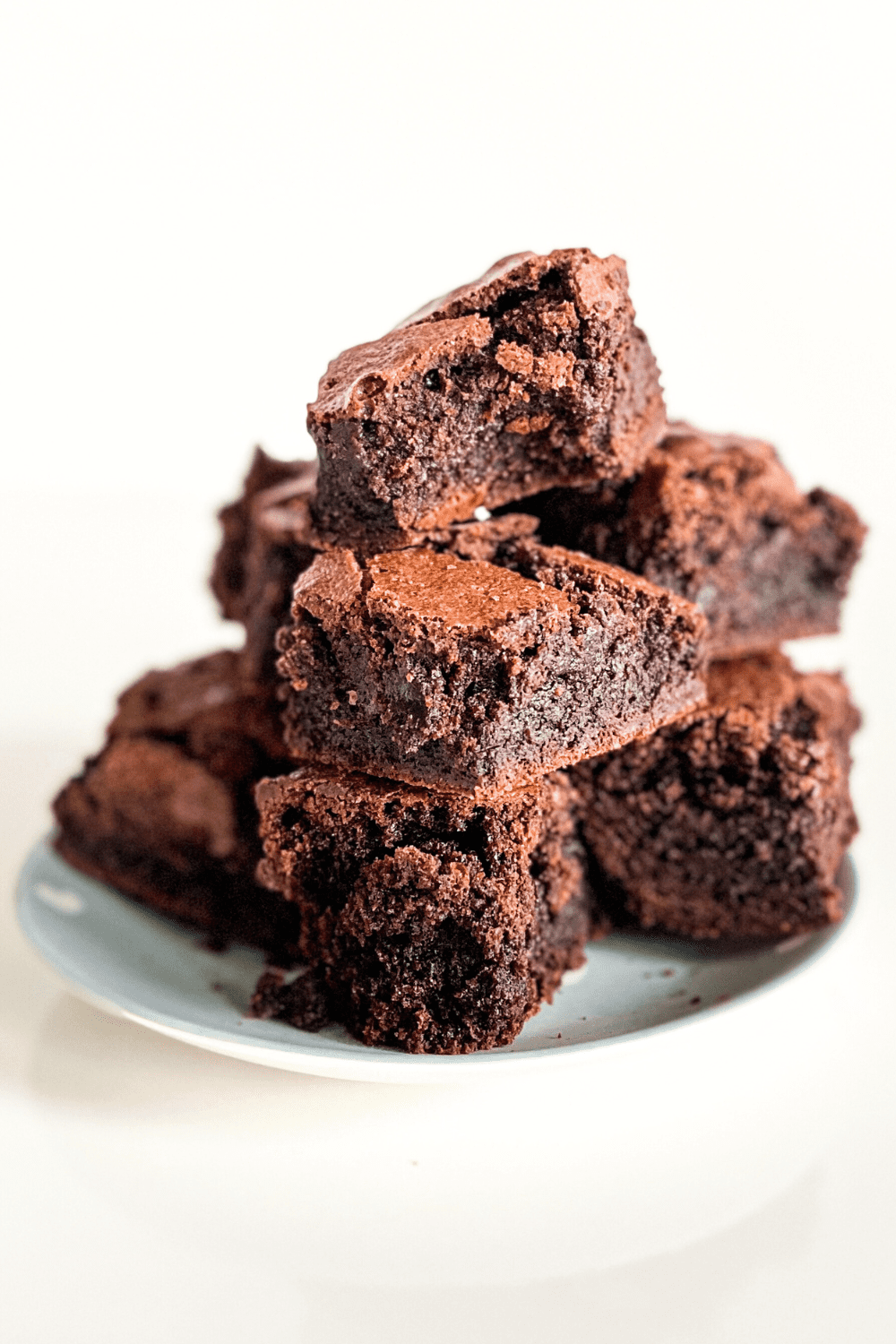 a plate stacked with high protein brownie recipe 