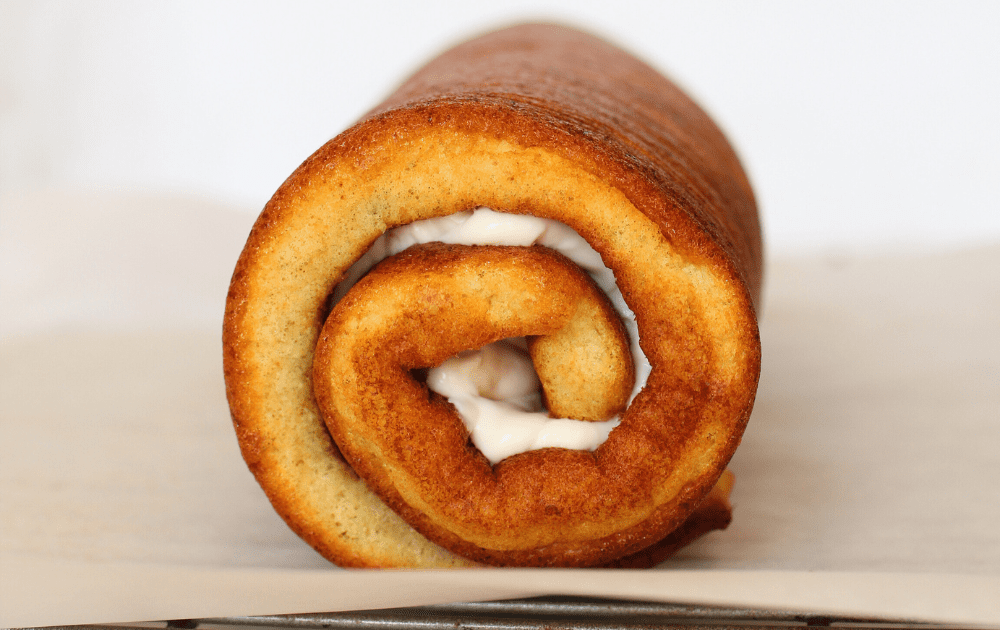 front view of beginner keto roll cake wrapped in a cylinder