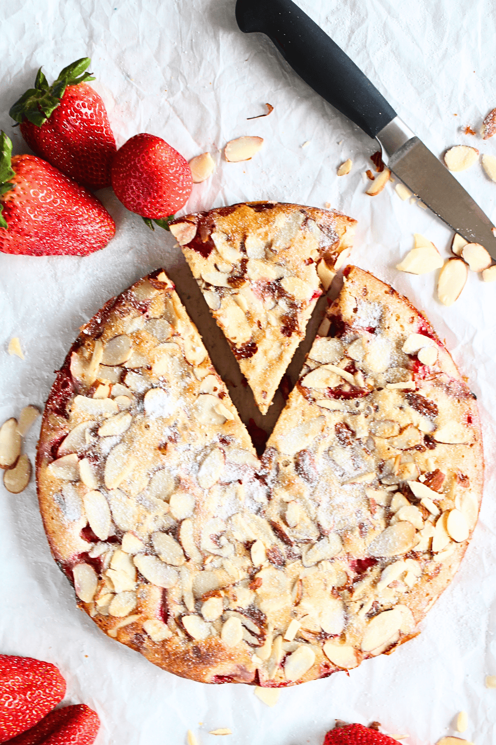 top view of a slice of keto crustless frangipane recipe with strawberries