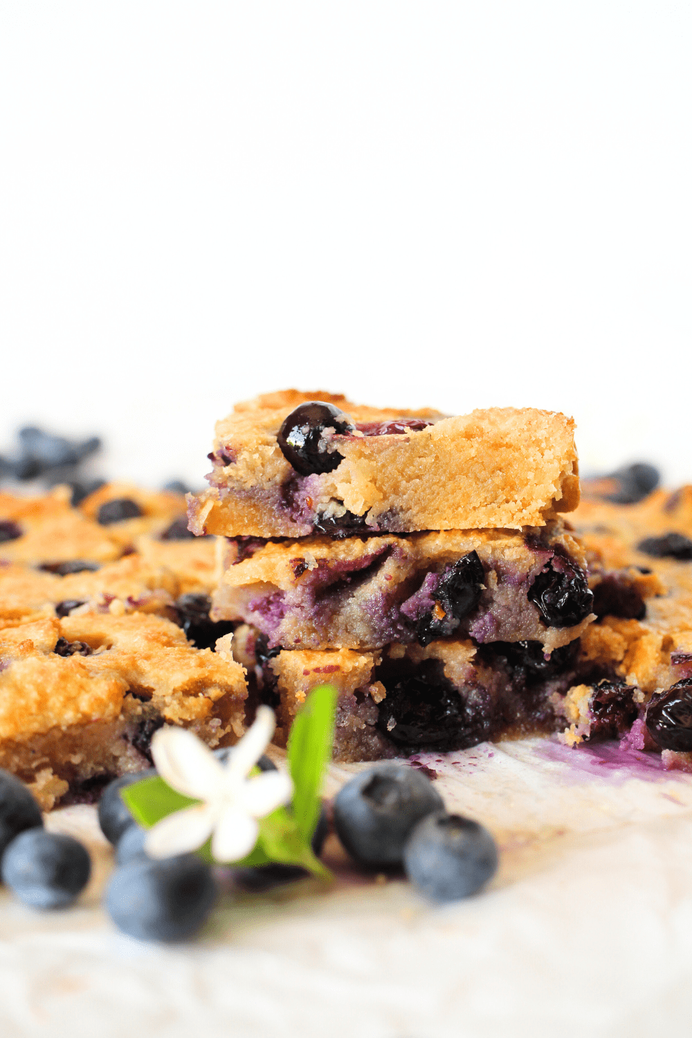 front view of 3 stacked keto blueberry blondies with collagen