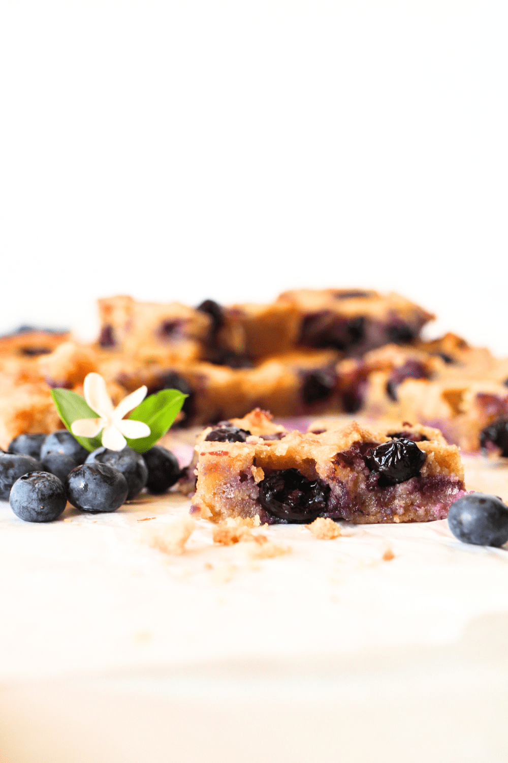 a keto blondie studded with fresh blueberries