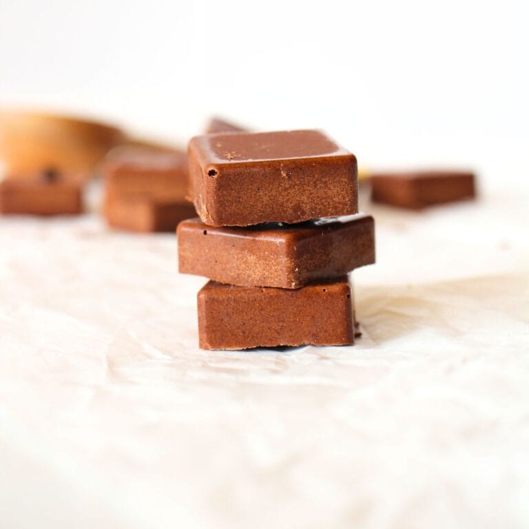 homemade fat fast bar that are shelf stable in chocolate flavour stacked on top of each other