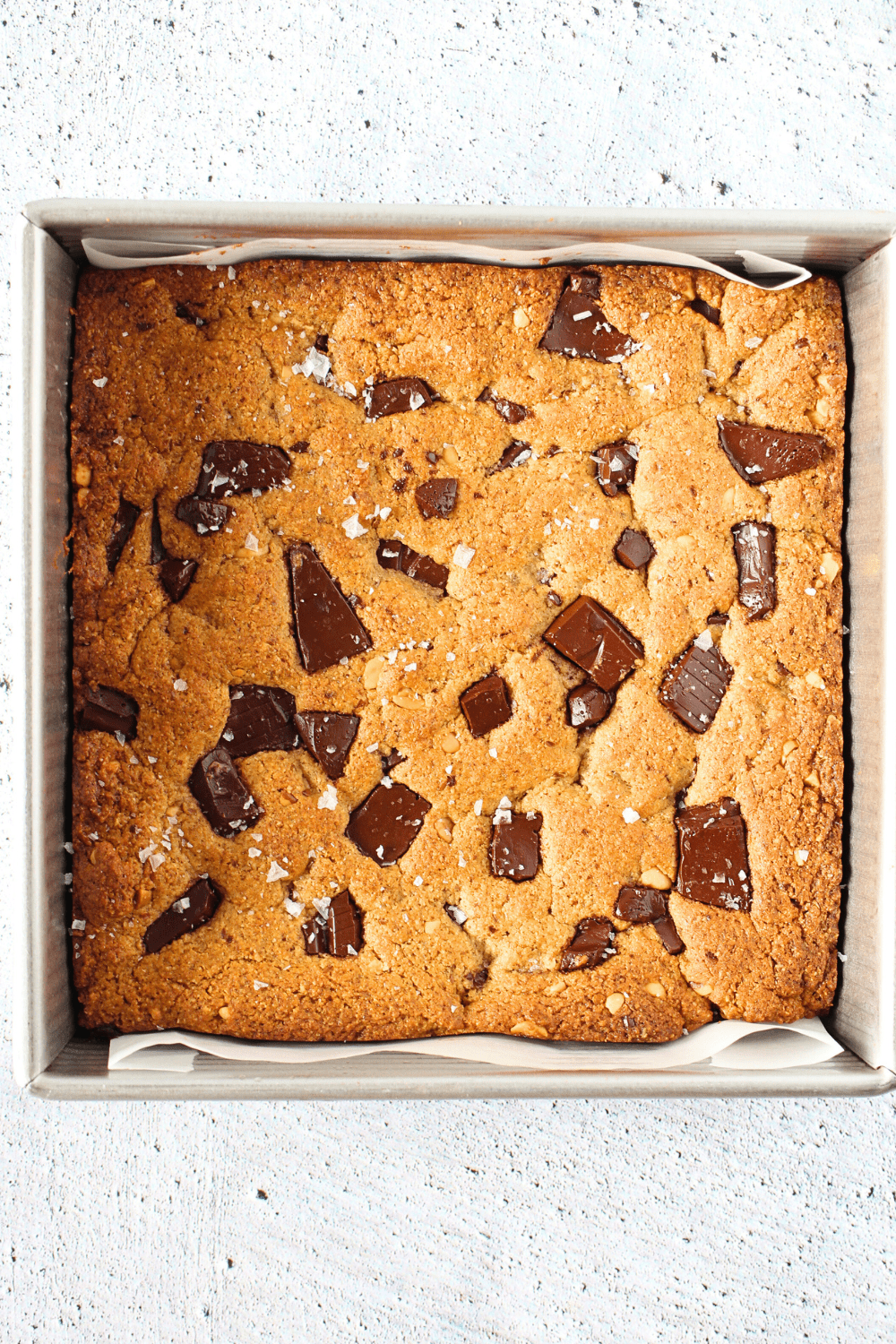 top view of baked high fiber keto recipe made into cookie bars with chocolate chunks on top