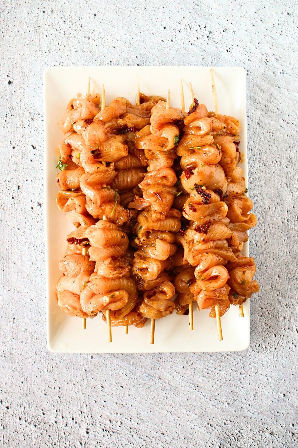 top view of keto chipotle chicken on skewers before being roasted