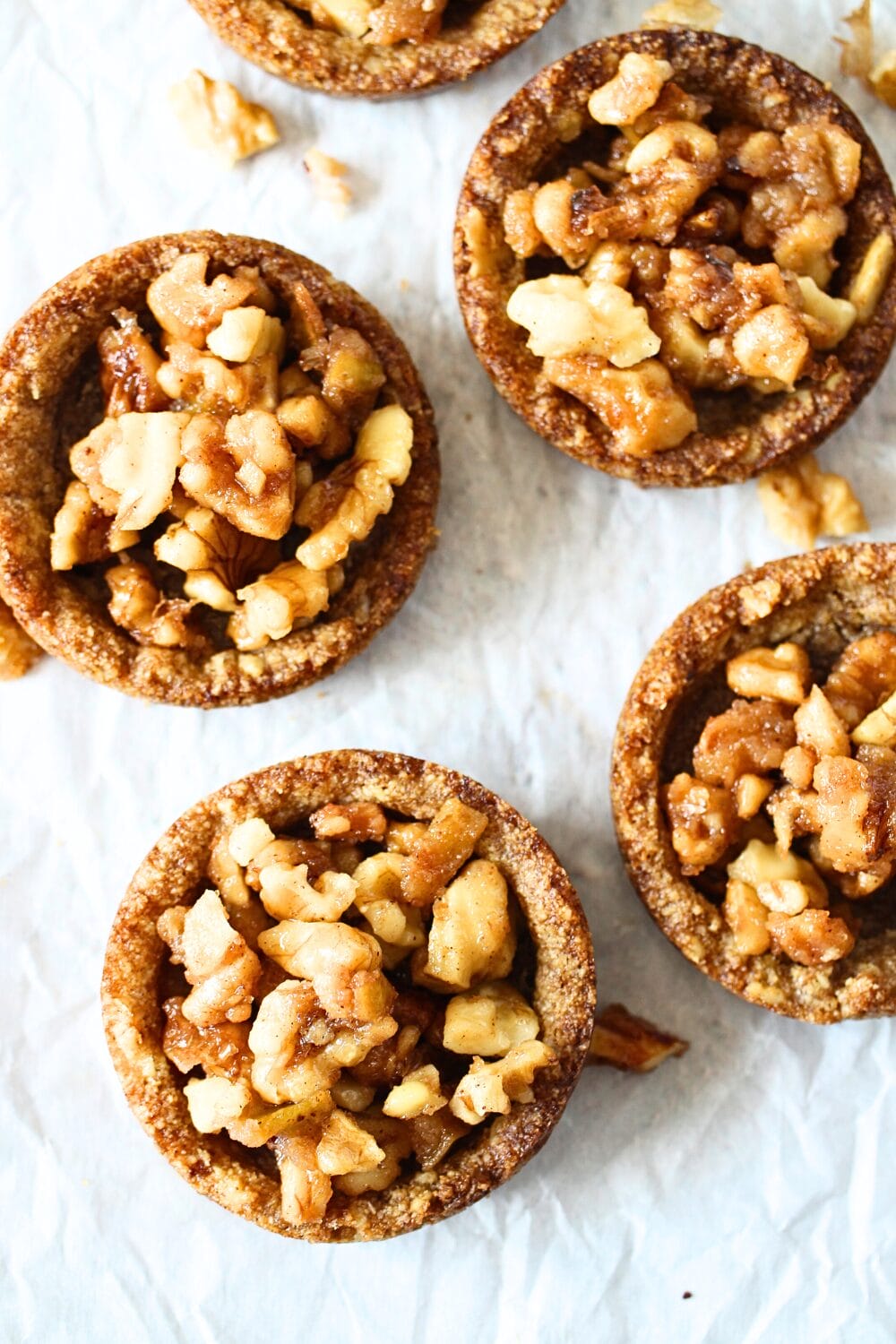 top view of keto caramel apple cookie cups with scattered nuts