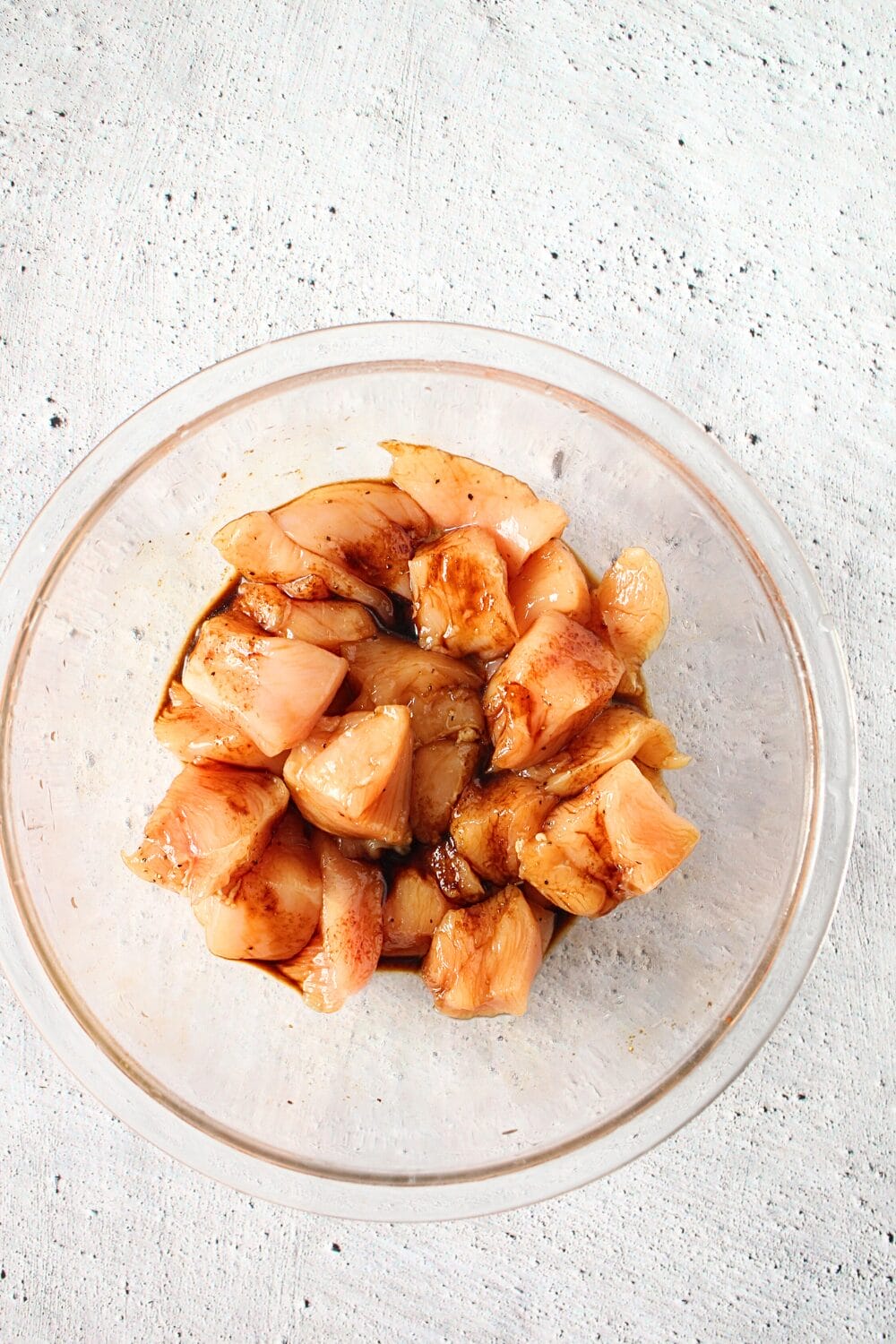 top view of keto cashew chicken being marinated in soy sauce mixture