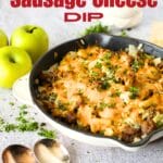 top view of an easy ketovore recipe made with 4 ingredients including sausage, onion, apple and cheese. apples and spoons are alongside this easy keto skillet recipe
