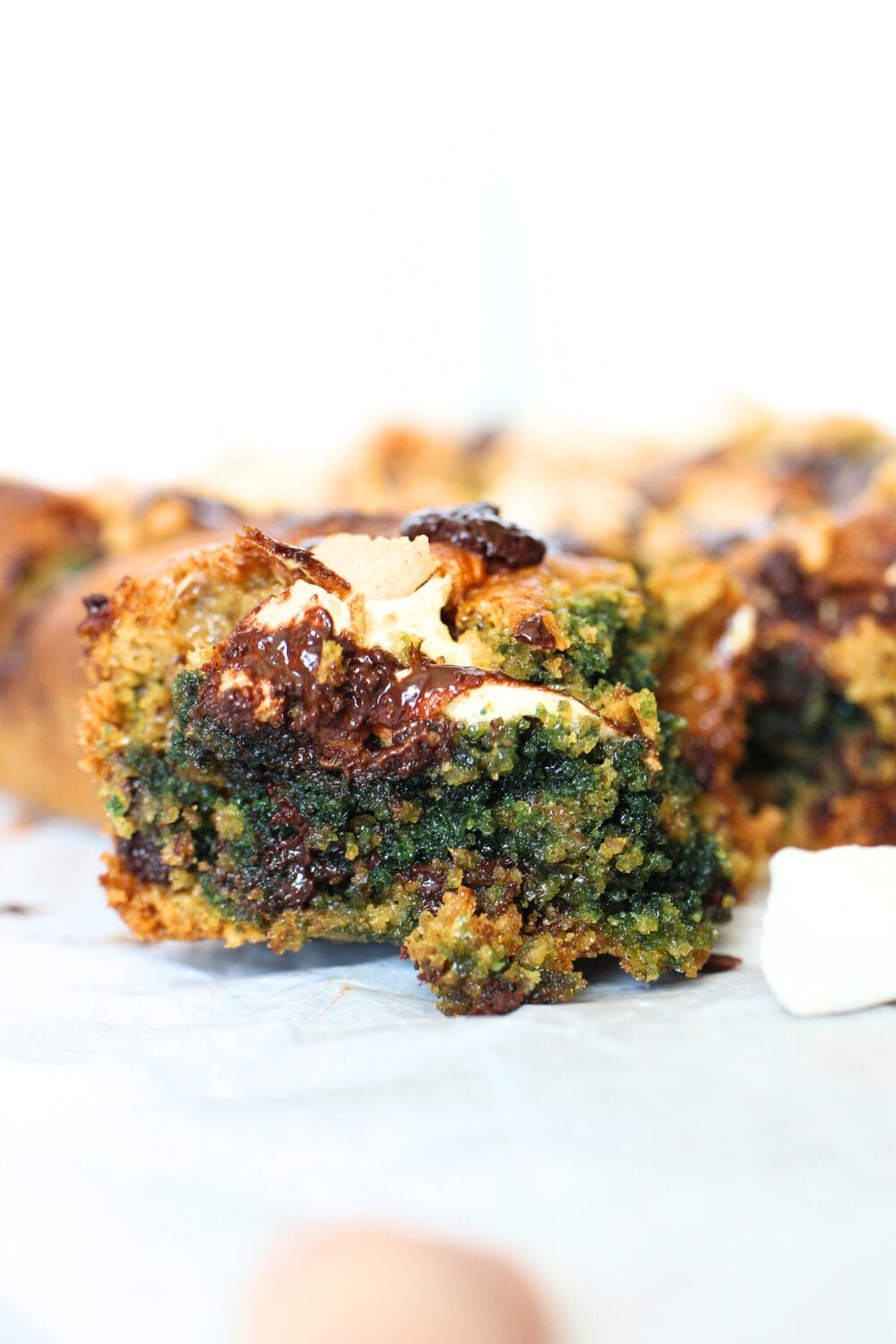 keto chocolate marshmallow bars using sunflower seed butter that turned the inside of the keto s'mores bars green!