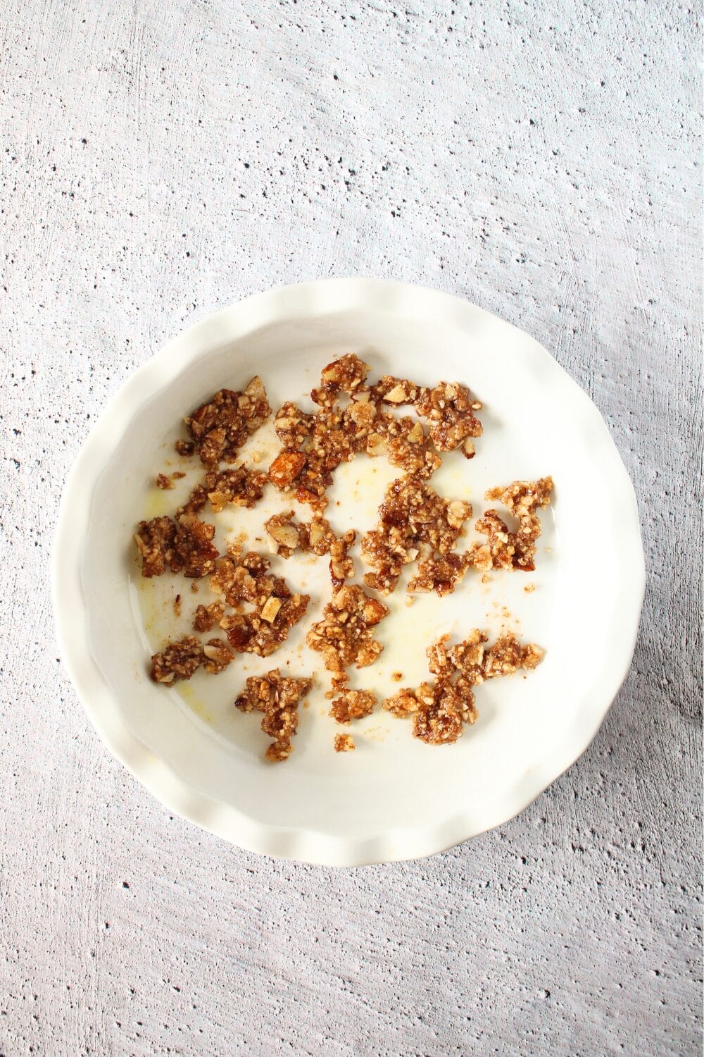 white pie pan for keto pumpkin recipe with the bottom crips in the pan