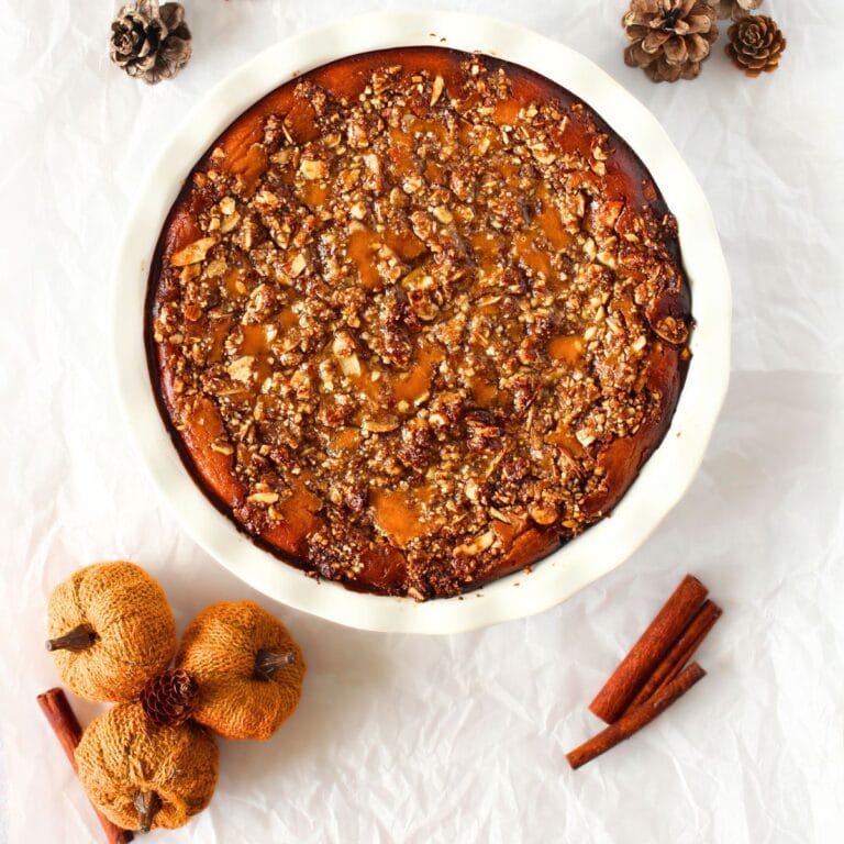 top view of healthy pumpkin crisp that is low carb and a sugar-free pumpkin recipe with decorative pumpkins to the side
