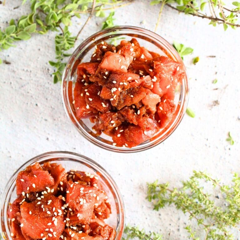 top view of keto salmon poke bowl with fresh herbs