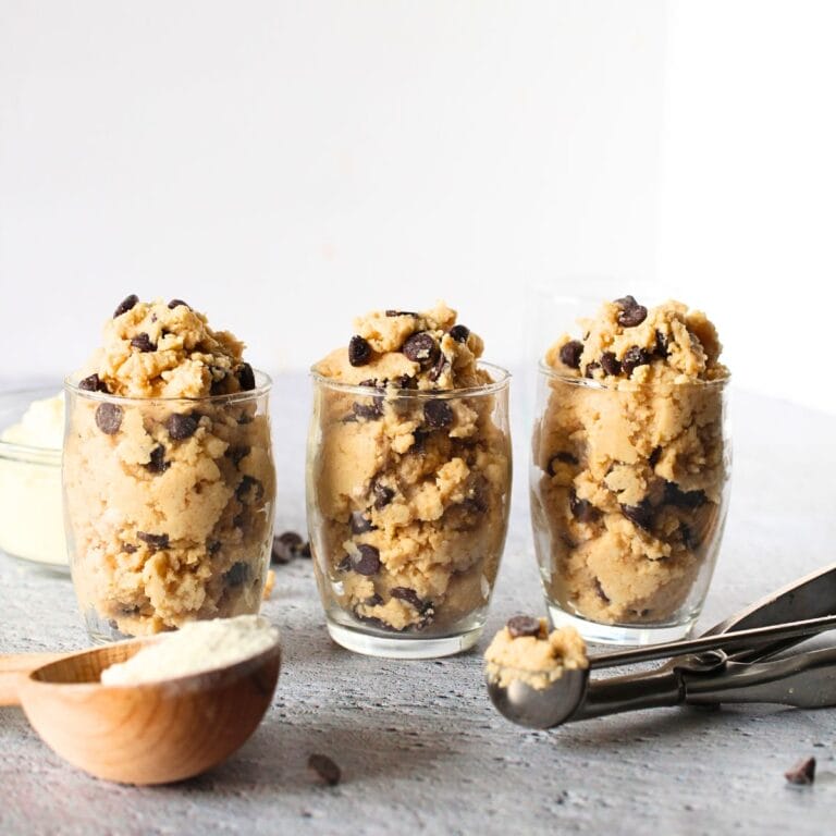 3 glasses filled with super healthy high protein cookie dough made with keto and sugar-free ingredients and protein powder