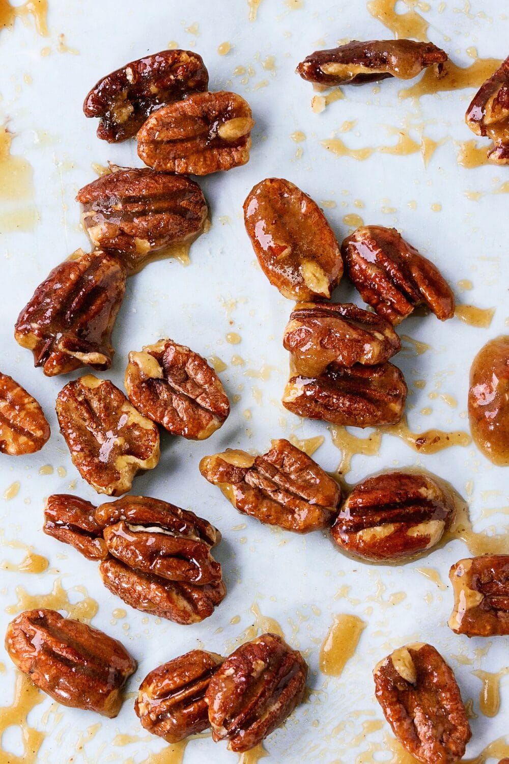 keto nut recipe step 2 - keto boubon nuts on a parchment lined baking sheet before being baked