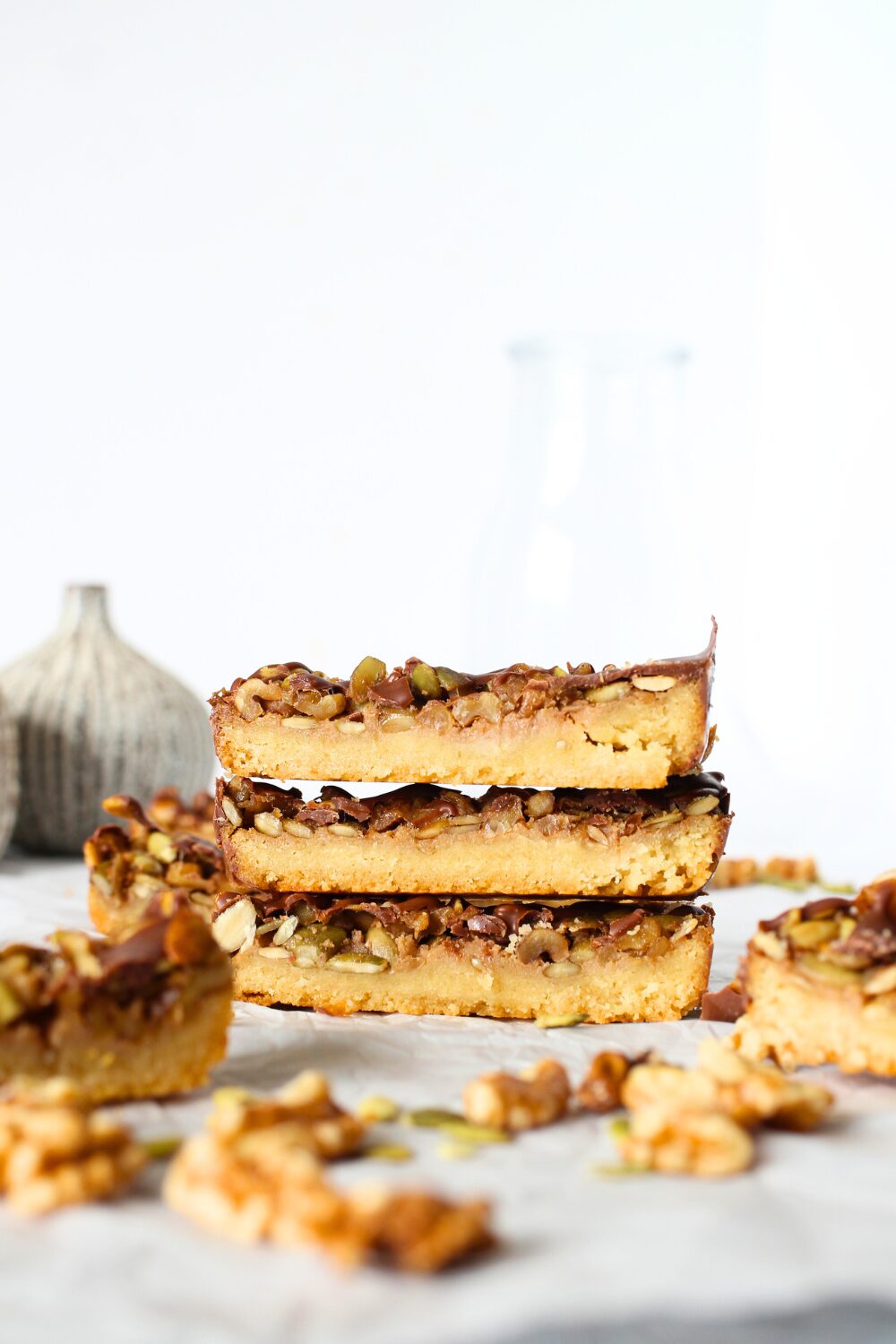 Easy Keto Shortbread Nut and Seed Bars with Chocolate Drizzle stacked on top of each other