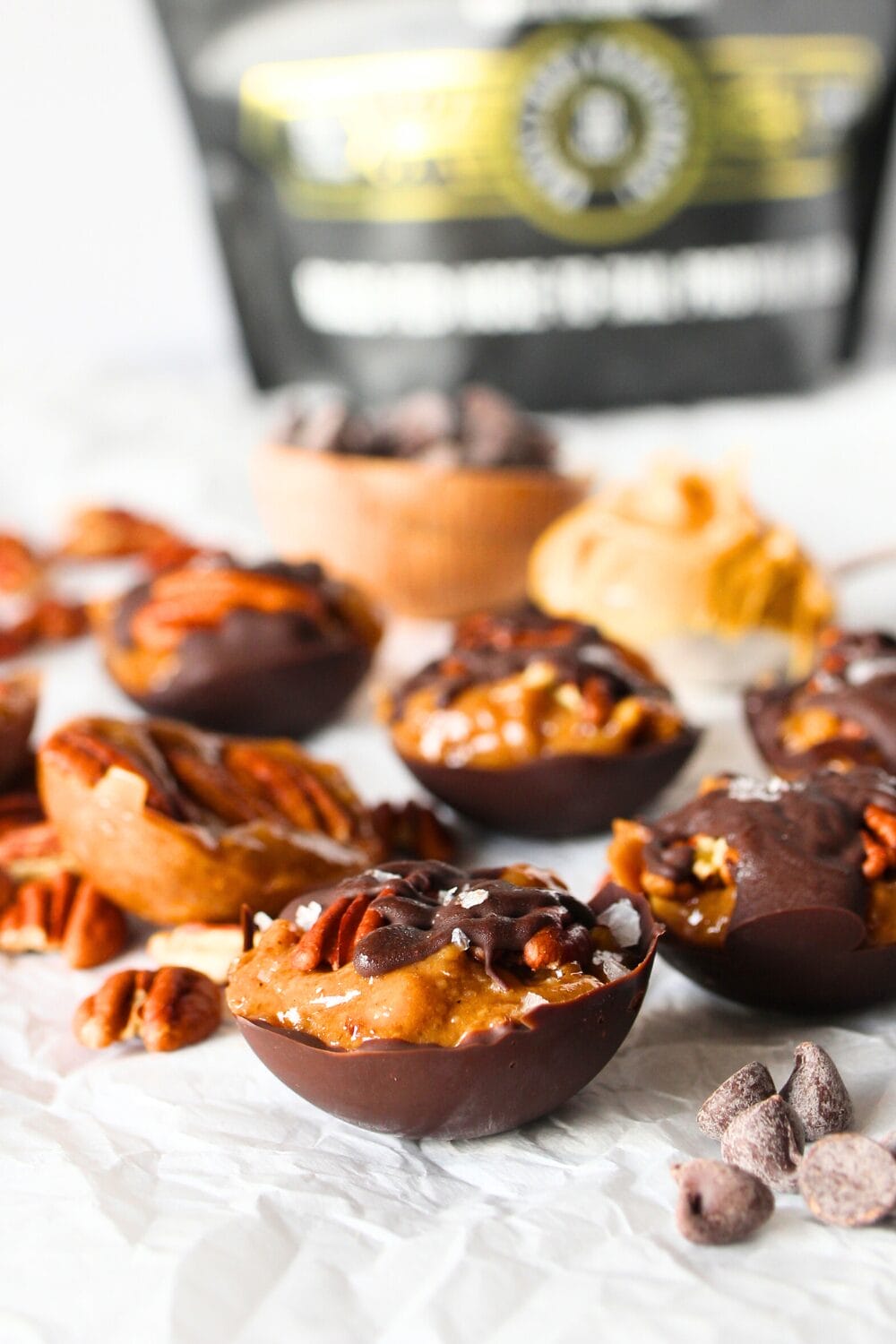front view of sugar-free nut clusters enveloped in caramel and sugar-free chocolate.