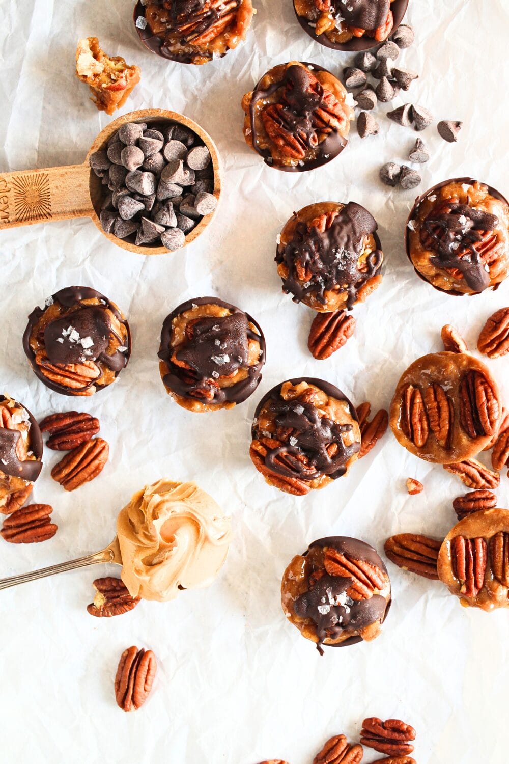 keto pecan caramel clusters with melted chocolate drizzled over the top 