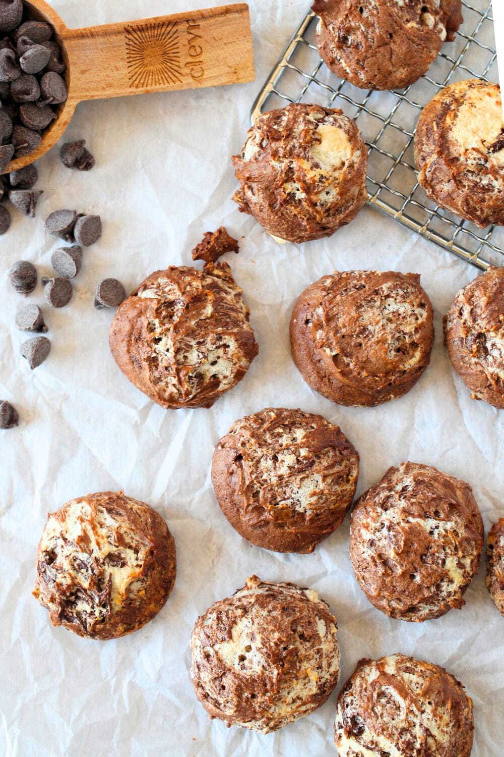 top view of high protein chocolate souffle cookies with sugar-free chocolate chips scattered around sugar-free cookies