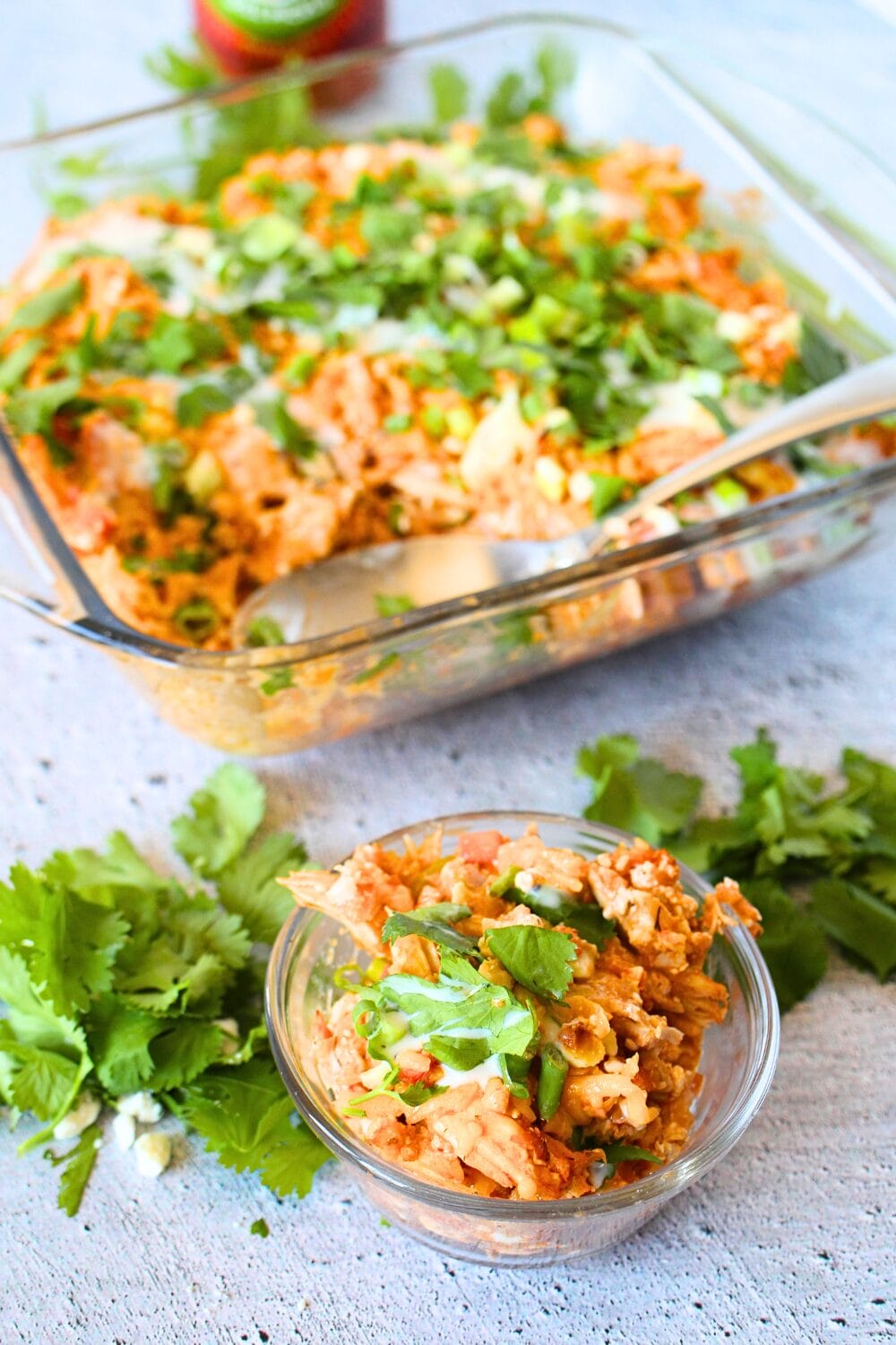 a serving in a bowl of healthy chicken casserole with cilantro sprinkled over the top