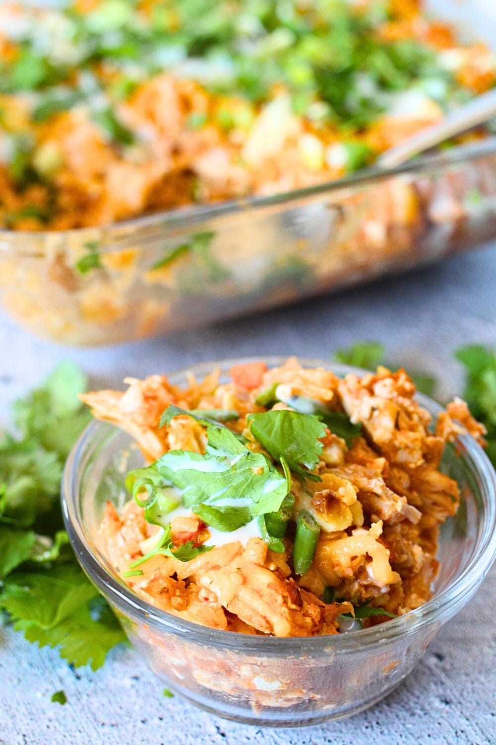 a bowl of healthy high protein Buffalo chicken casserole with cilantro leaves