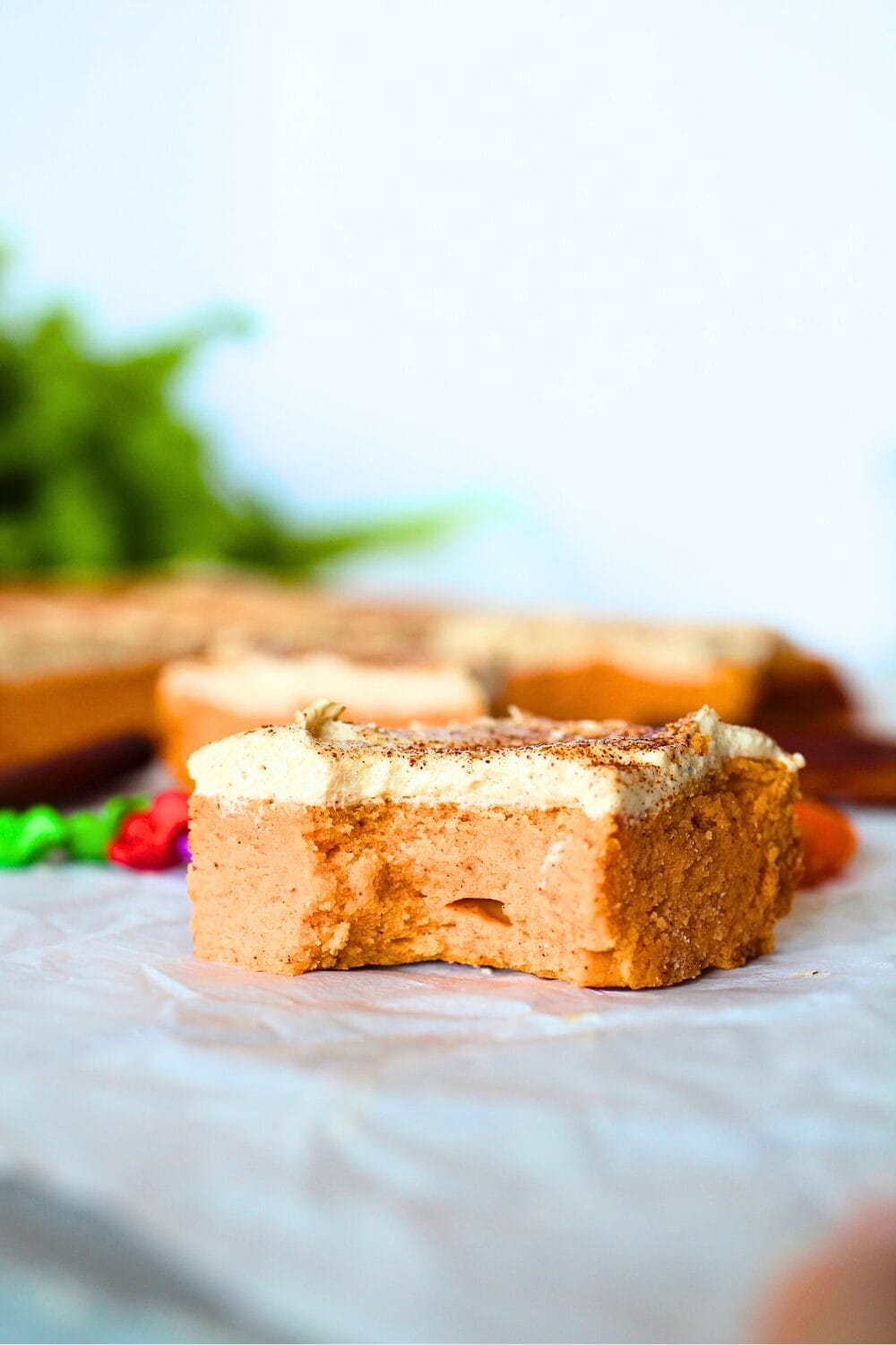 front view of baked protein bar with a bite taken out of the high protein bar